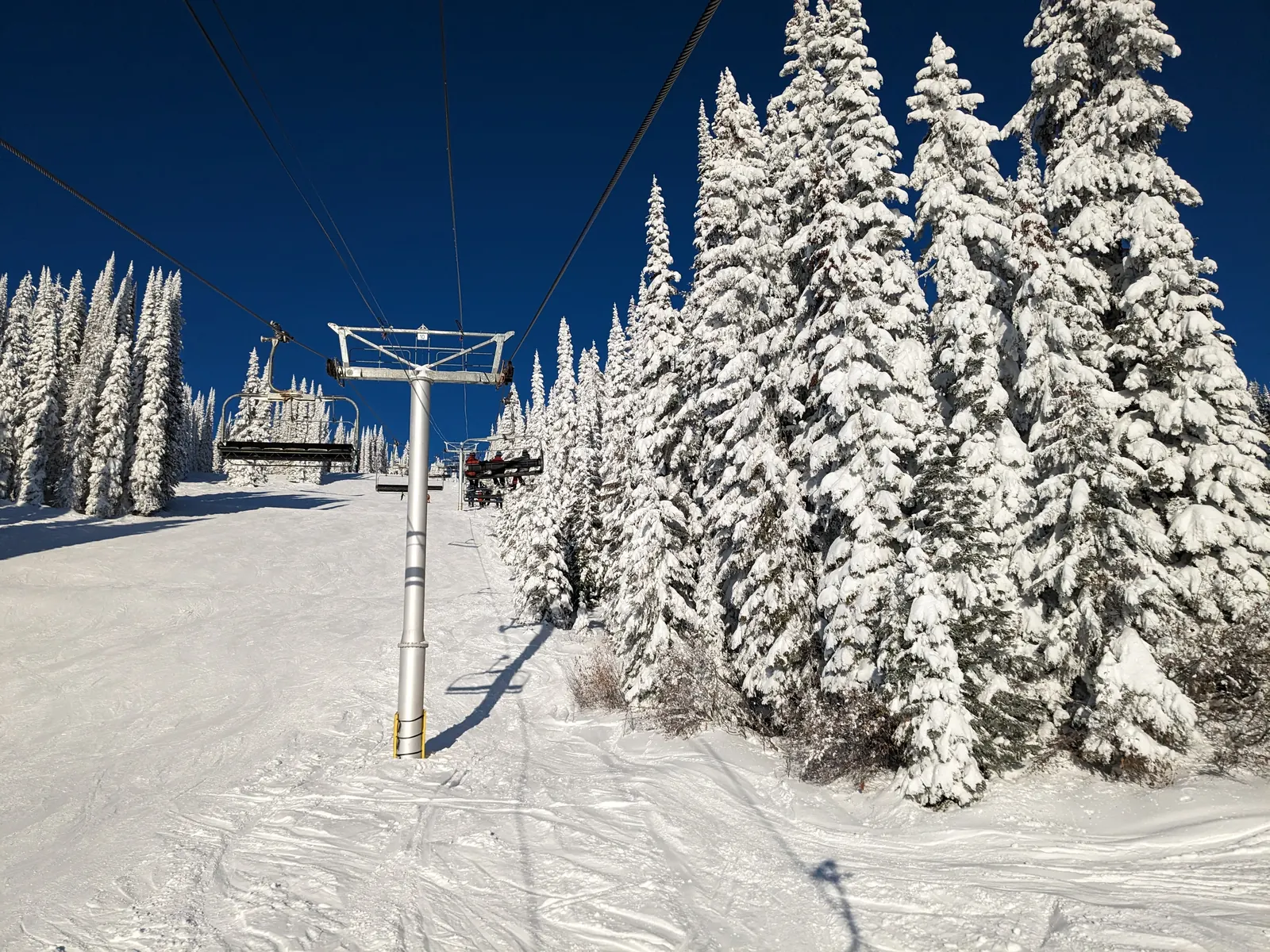 A chairlift line through snow ghosts at SilverStar