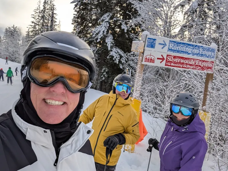 Guests at the Running Bear and Silverwoods trail signs at SilverStar