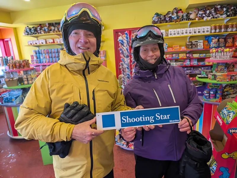 Guests in a village shop with a Shooting Star sign at SilverStar