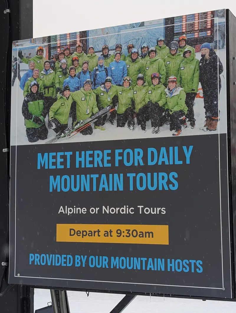The “Meet here for daily mountain tours” sign: alpine or Nordic tours depart at 9:30 a.m.
