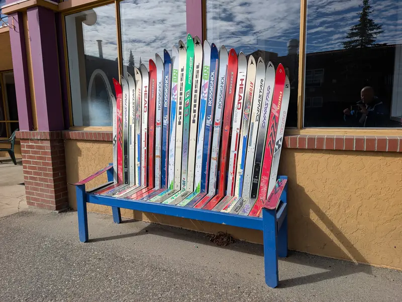 A bench built from old skis in the village