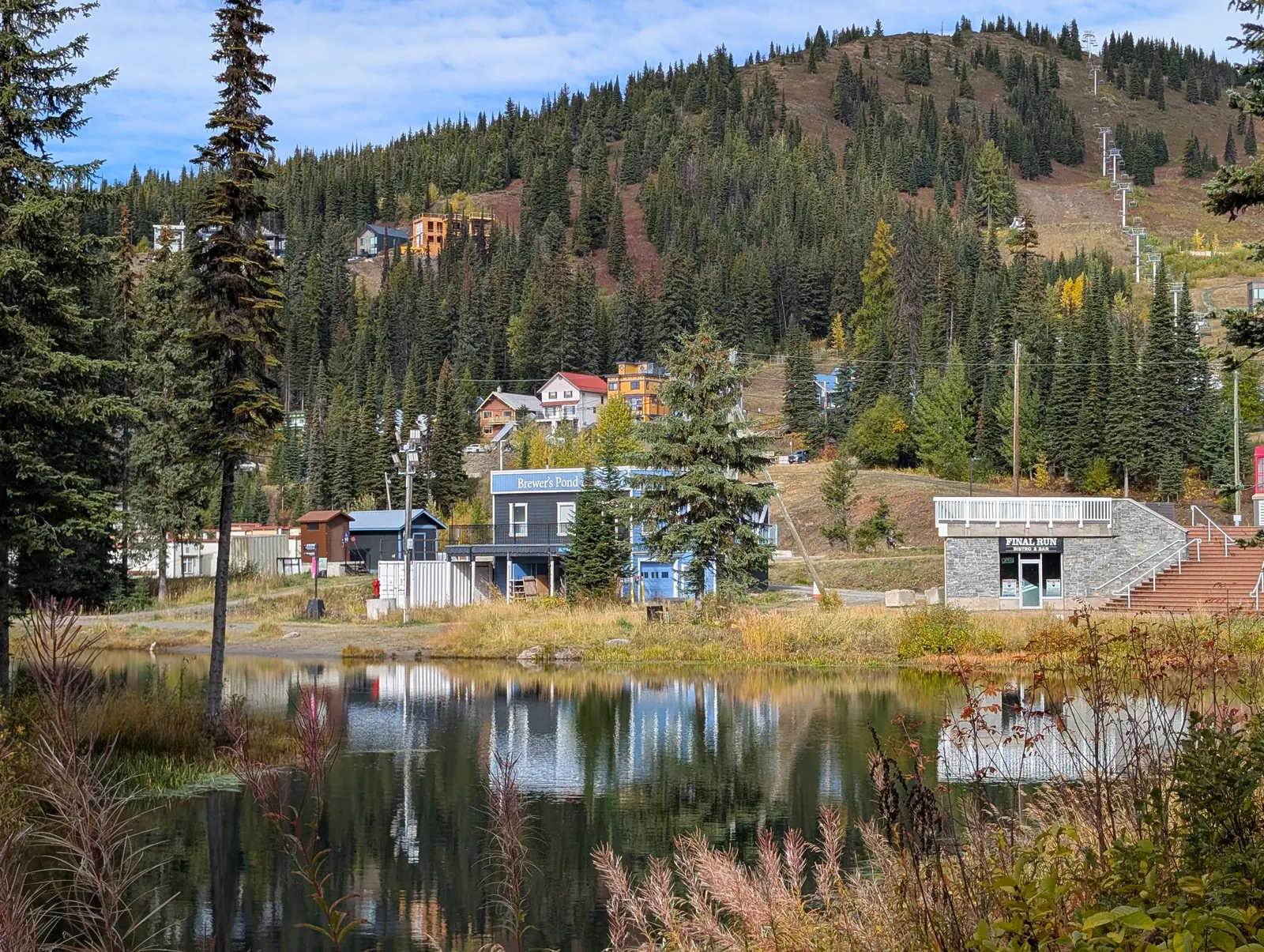 Fall colours around a pond in SilverStar village