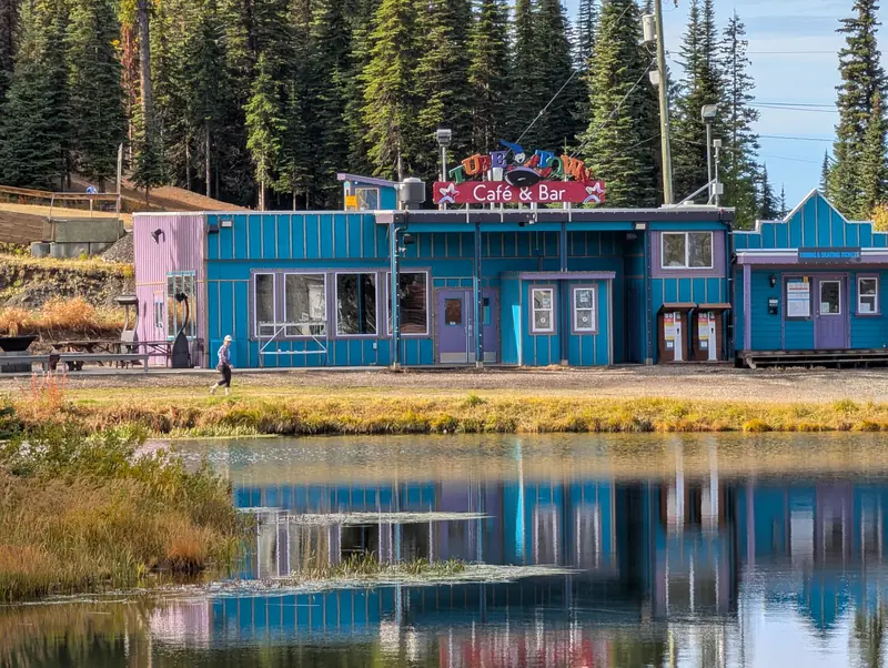 Colourful village building reflected in a SilverStar pond